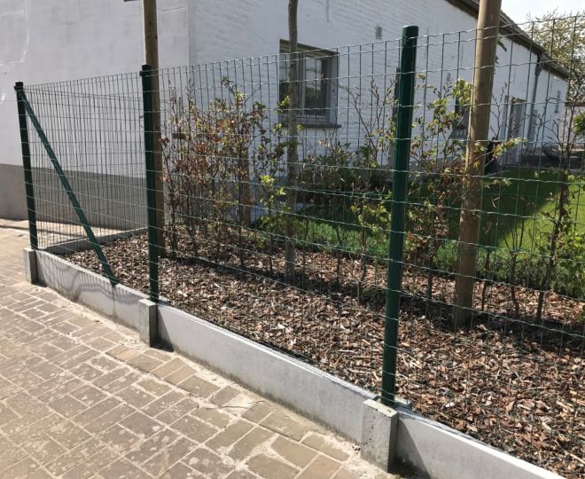 wire mesh fence with concrete slab